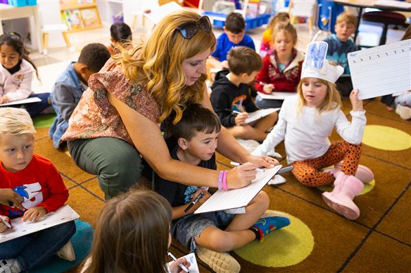 Students inside their classrooms learning. 